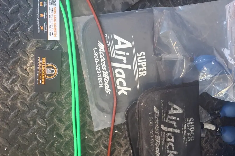 AirJack inflatable wedges and a long-reach tool used to open locked cars